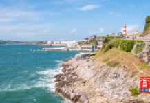 Coastline in Plymouth with its iconic lighthouse.